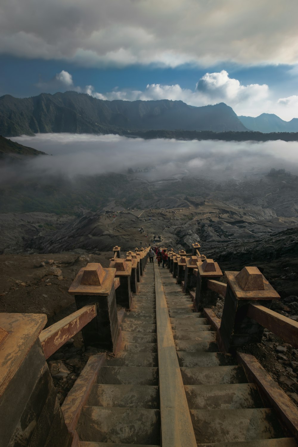 a group of people walking up a set of stairs