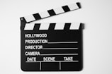a black and white movie clapper on a white background