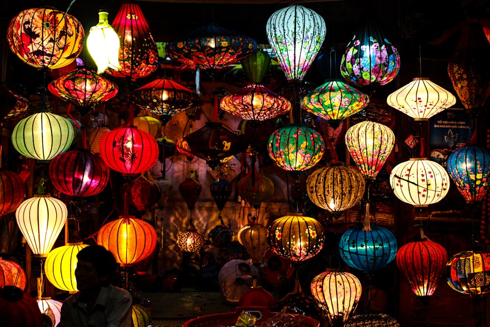 a bunch of colorful lights hanging from the ceiling