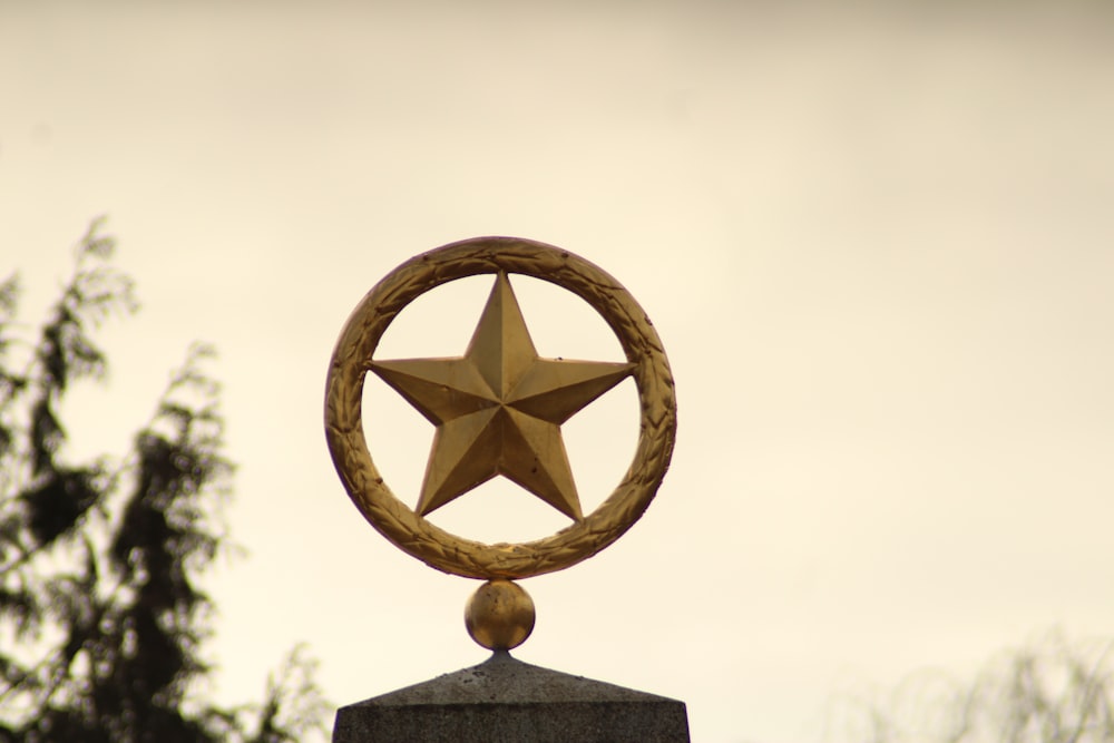 a golden star on top of a monument