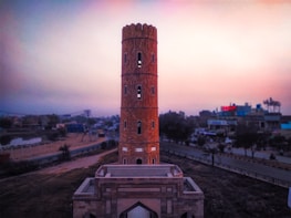 The iconic Markka Watch Tower standing tall against a sunset backdrop.