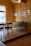 Cozy modern interior of Fans Cafe Ponorogo with warm lighting and wooden tables.