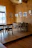 Cozy modern interior of Fans Cafe Ponorogo with warm lighting and wooden tables.