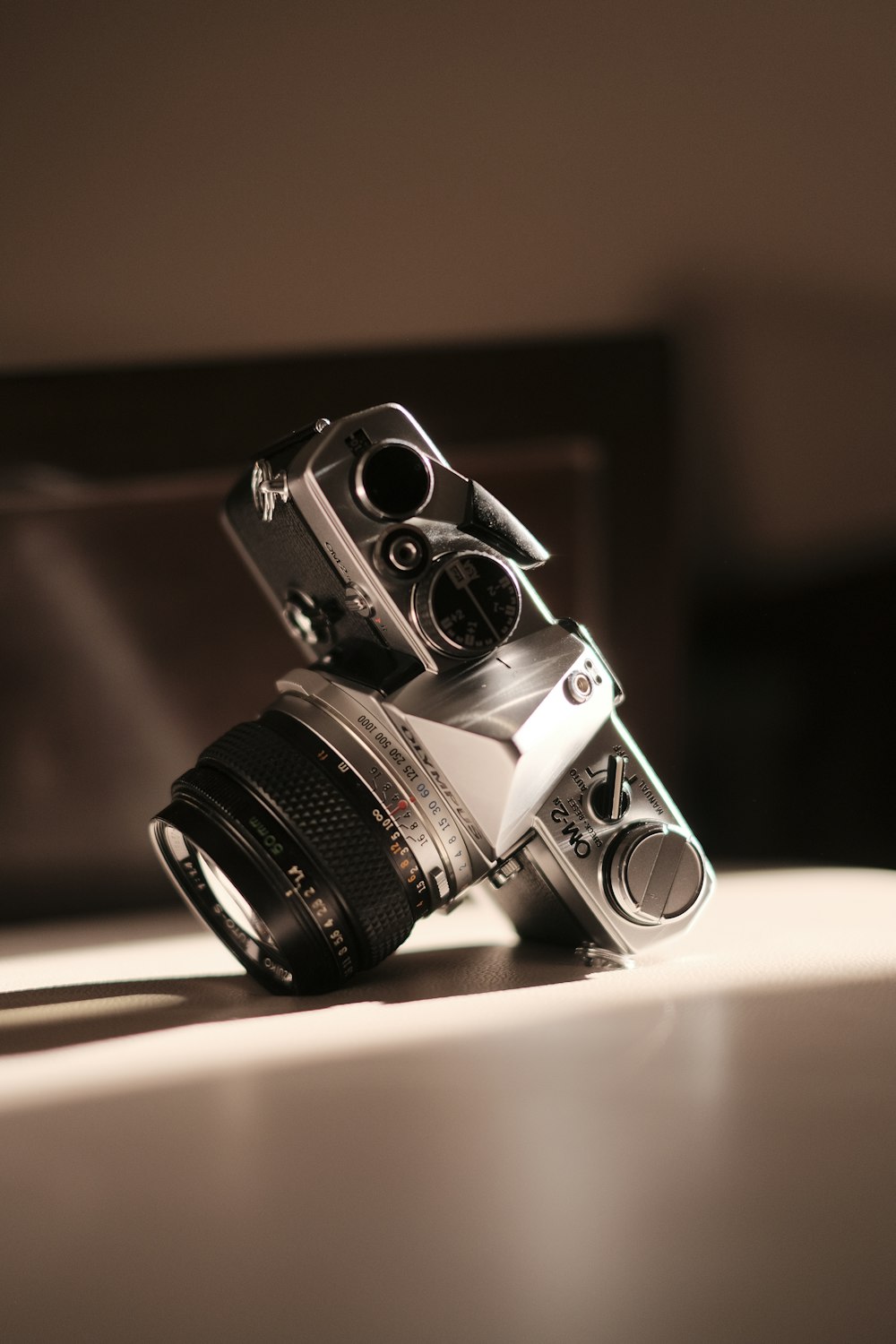 a silver camera sitting on top of a table