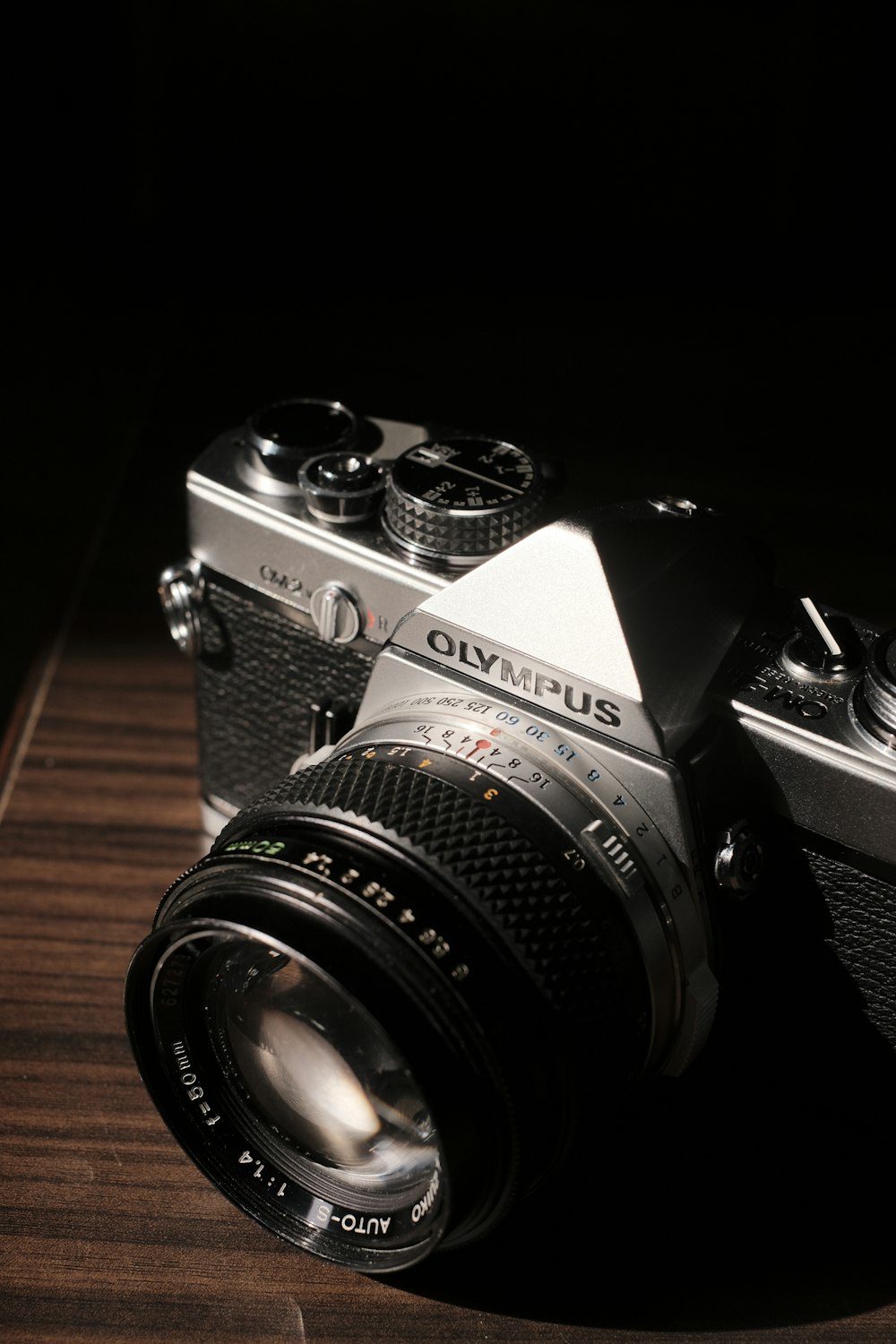 a camera sitting on top of a wooden table