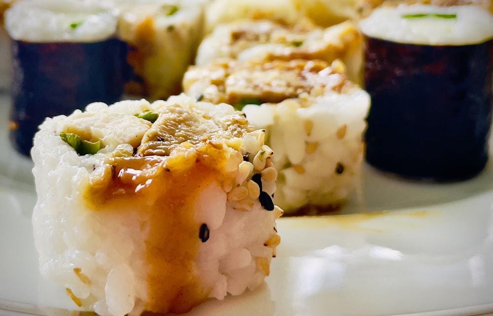 a close up of sushi on a plate on a table