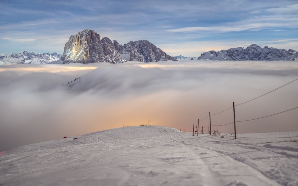 a view of a mountain covered in clouds