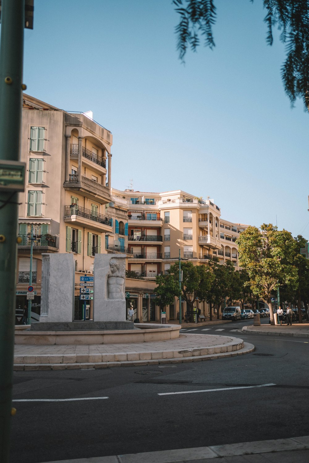 a street corner with a building in the background