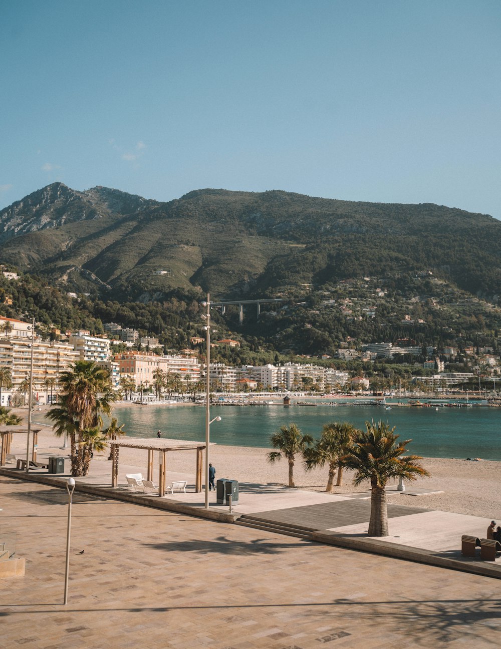 a view of a beach with mountains in the background