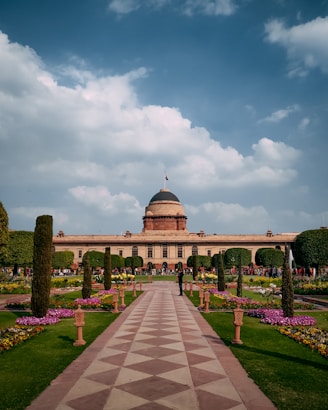 a large building with a checkered walkway in front of it
