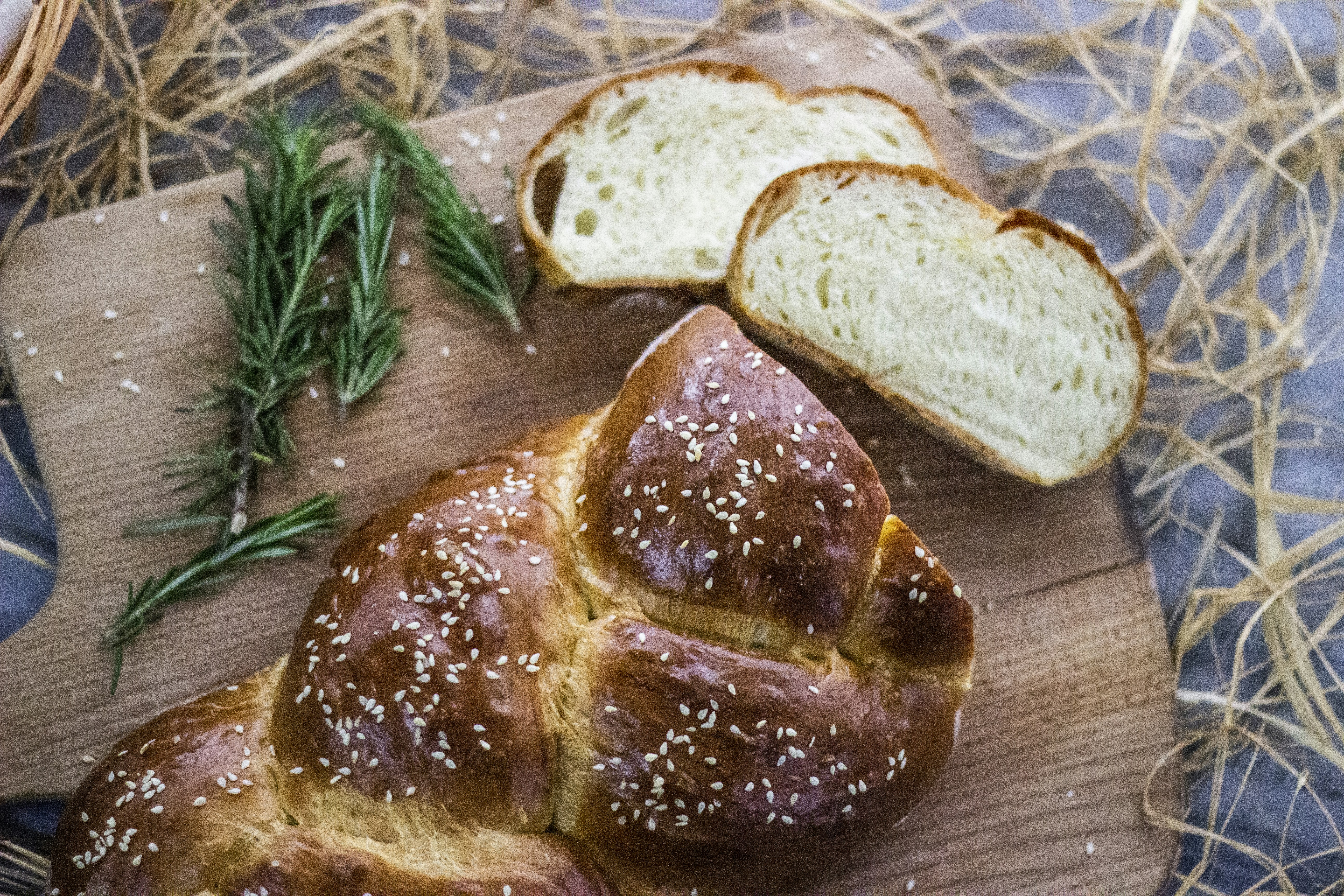 a loaf of bread sitting on top of a wooden cutting board