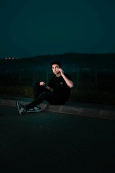 Friendly trip coordinator assisting a traveler via phone at night.