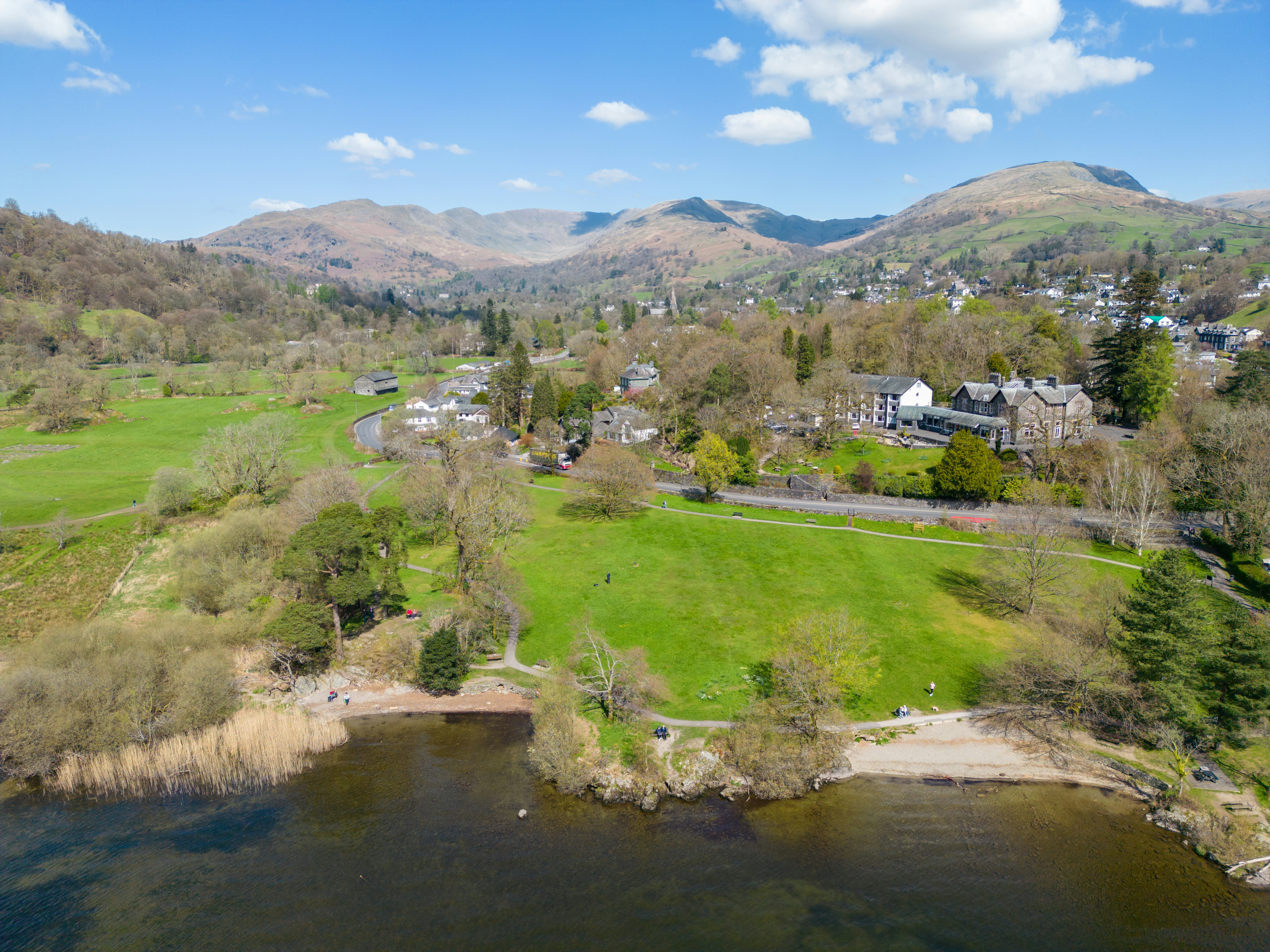an aerial view of a small town and a lake