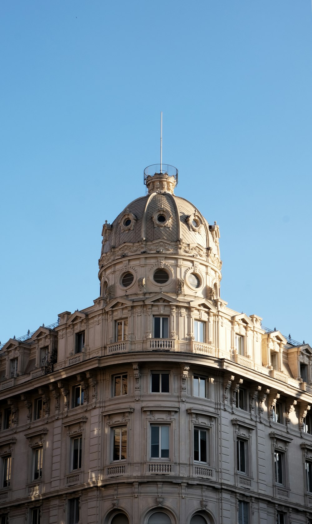 a tall building with a clock on the top of it