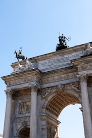 a large arch with statues on top of it