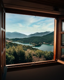 A beautiful view from a hotel room window overlooking a scenic landscape.