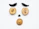 Various nuts and dried fruits arranged on a white surface to resemble a face, with two long dark fruits as eyebrows, two round nuts as eyes, a small dark nut as the nose, and a larger nut as the mouth.
