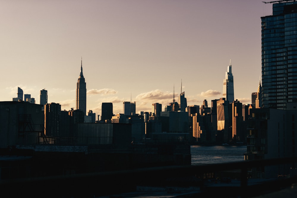 a view of a city skyline at sunset