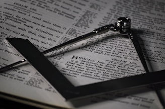 a cross on top of an open book