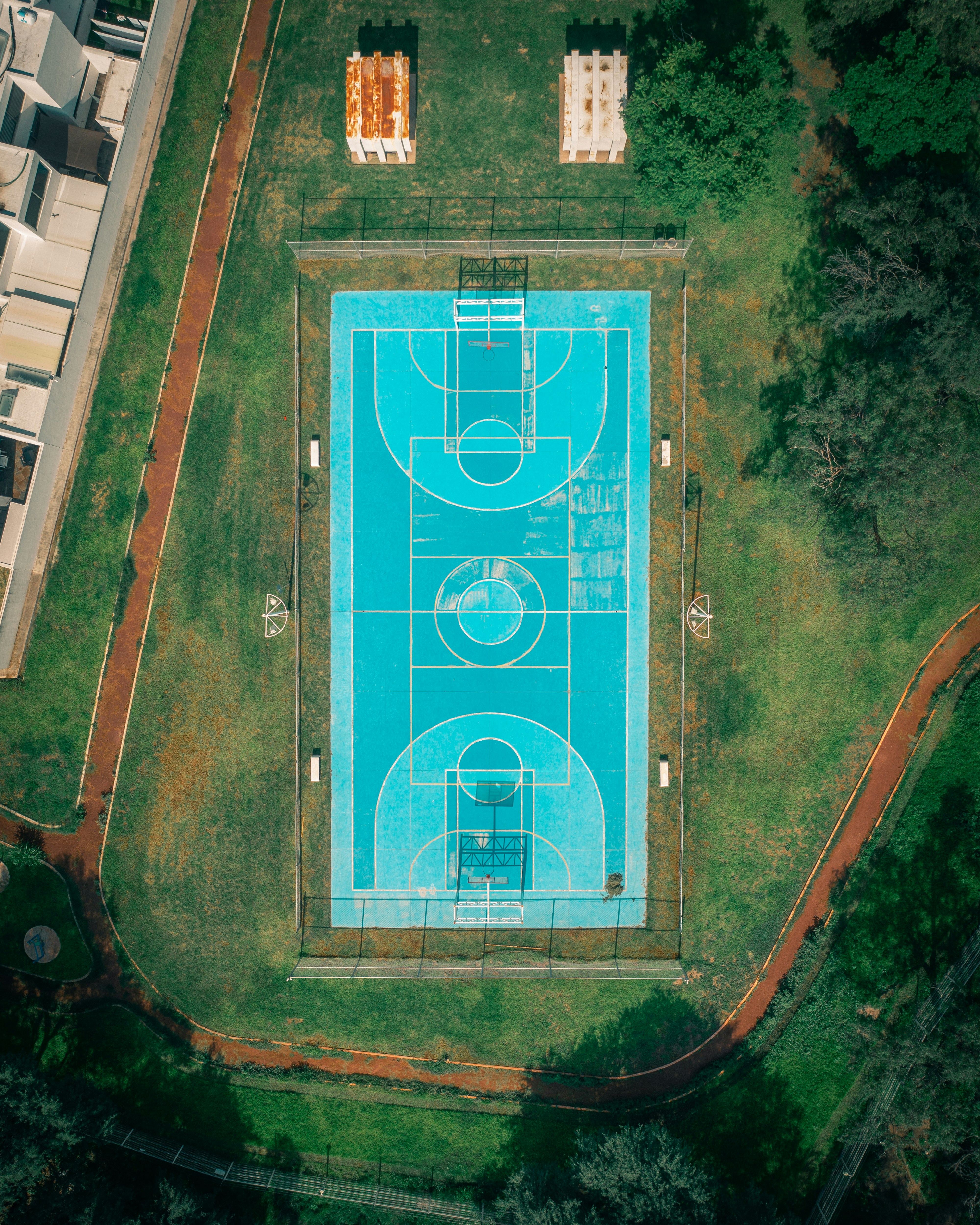 An aerial view of a basketball court in a park photo Free