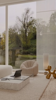 A sleek, modern living room with floor-to-ceiling windows and natural wood accents.