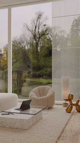Interior view of a modern living room with minimalist decor and natural light flooding in.