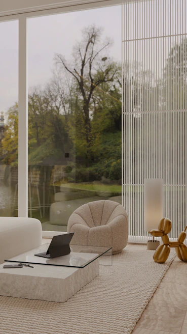 Interior view of a sleek living room featuring natural light and minimalist furniture