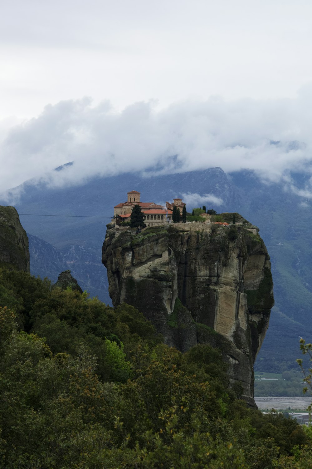 a castle perched on top of a cliff