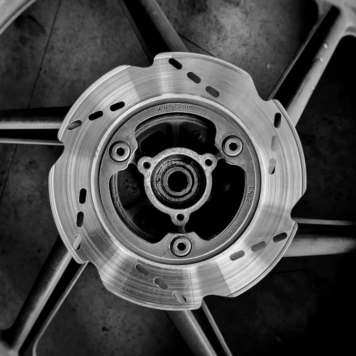Close up of wheel and brake caliper finish