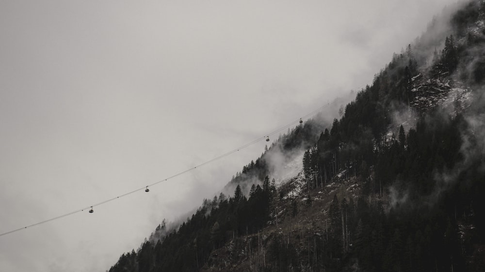 a ski lift going up the side of a mountain