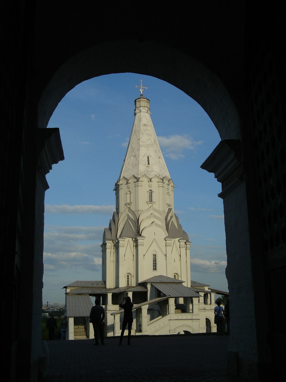 a view of a church through an archway