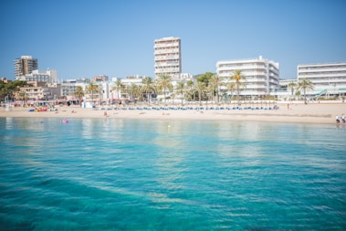 a beach with a bunch of buildings in the background