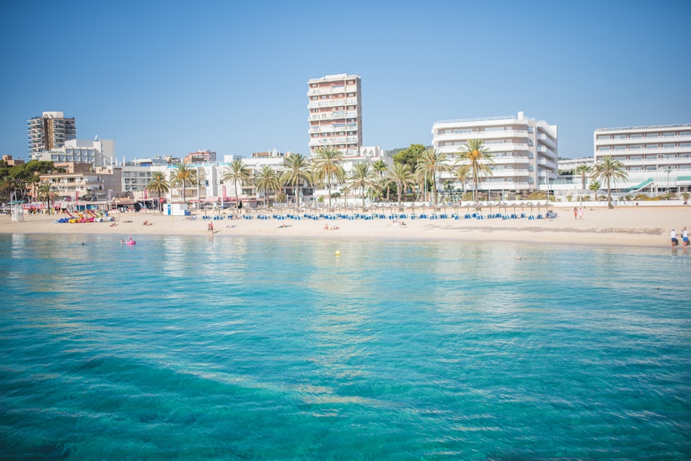 a beach with a bunch of buildings in the background