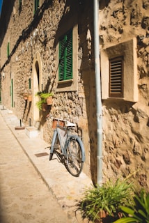 a bike parked on the side of a building