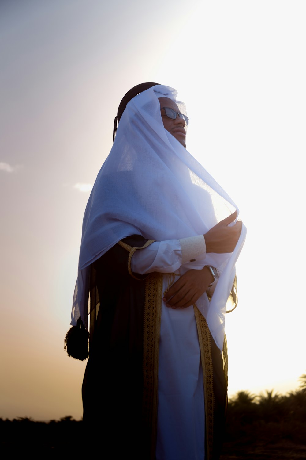 a man dressed in a white and black outfit