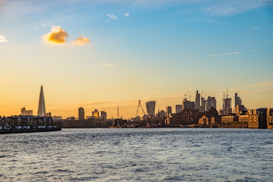 View of London’s iconic skyline featuring the Shard and the Thames at sunset