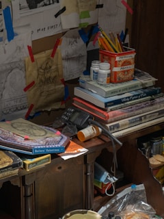 An artist’s desk scattered with sketches and drafts for upcoming puzzle book designs.