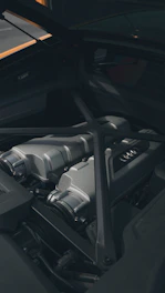 A Peugeot car engine bay showing structural components.