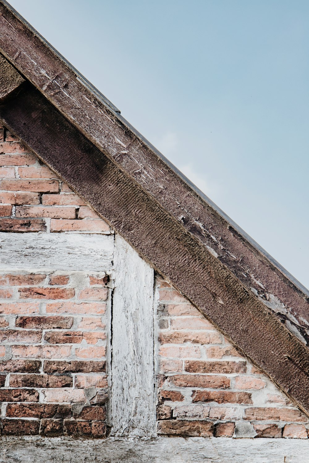 an old brick building with a white door