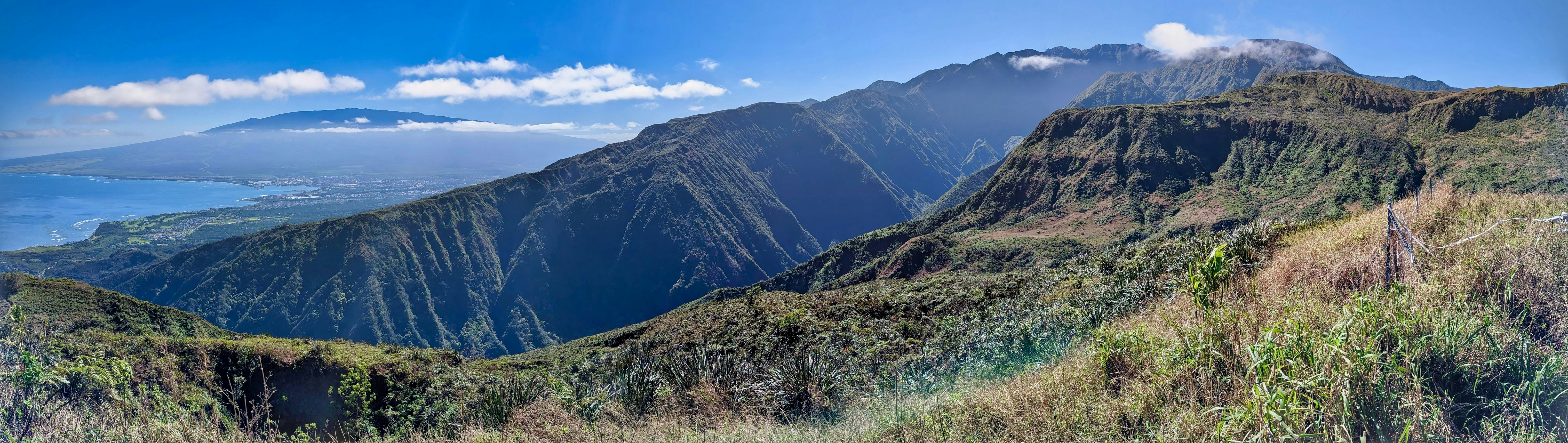 a view of a mountain range with a body of water in the distance