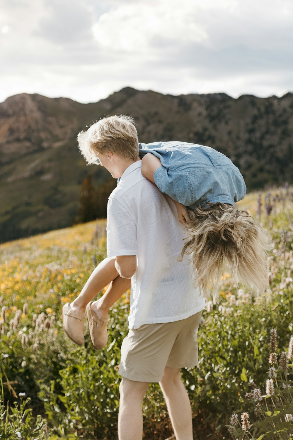 a boy carrying a girl on his back