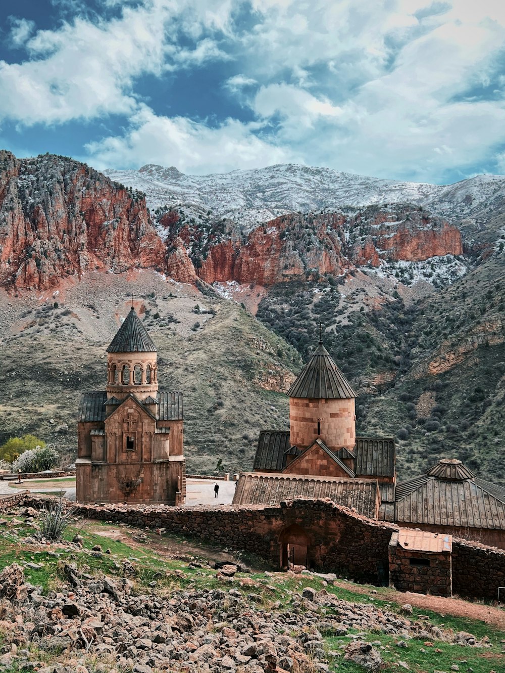 an old church in the middle of a mountain range