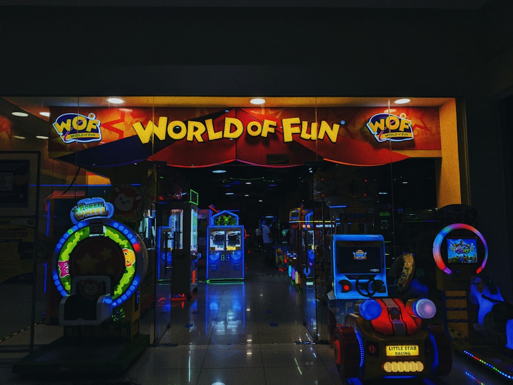 a store front with a neon sign that says world of fun