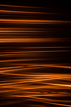 Vibrant motion graphic animation featuring bold orange streaks on a dark backdrop.