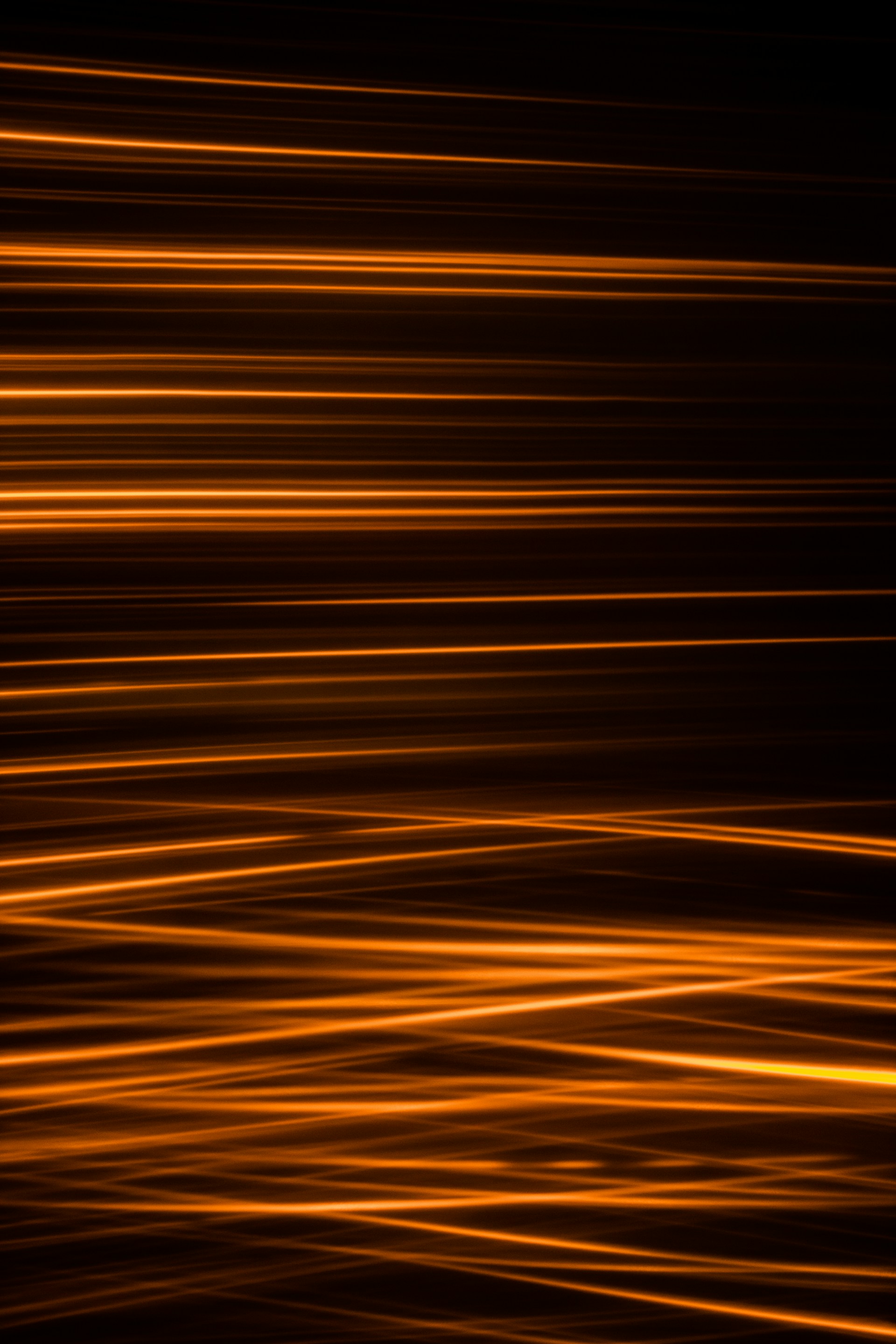 an orange and black background with lines