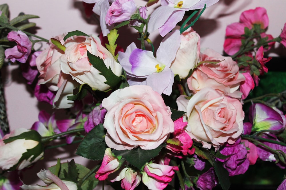 a bouquet of pink and white flowers on a table