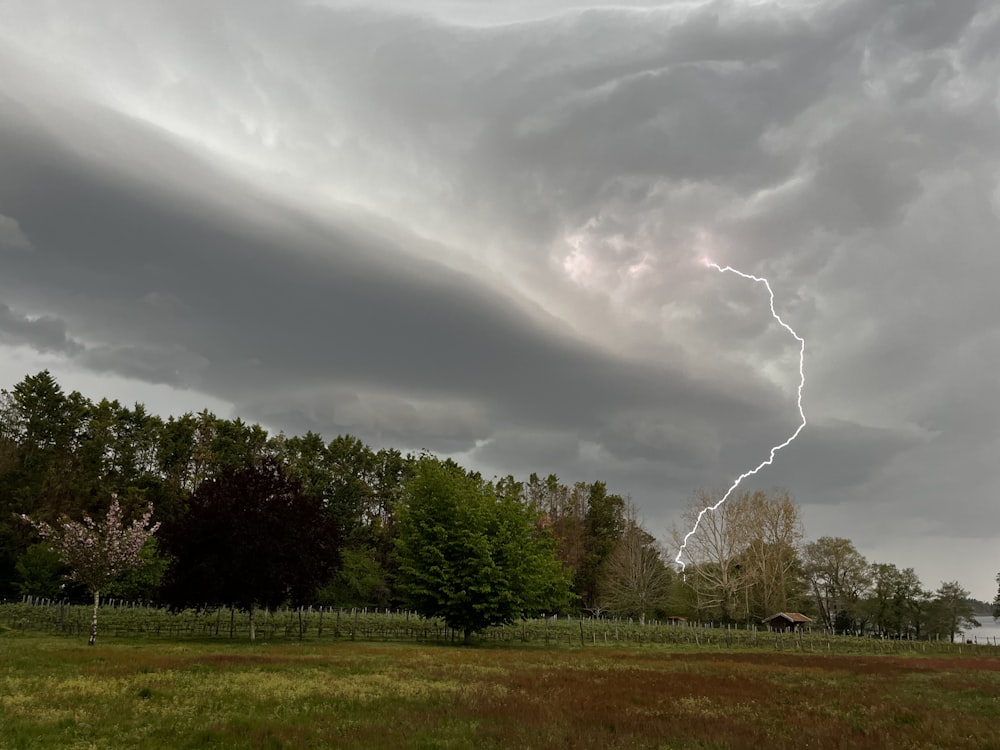 a large cloud with a lightning bolt coming out of it