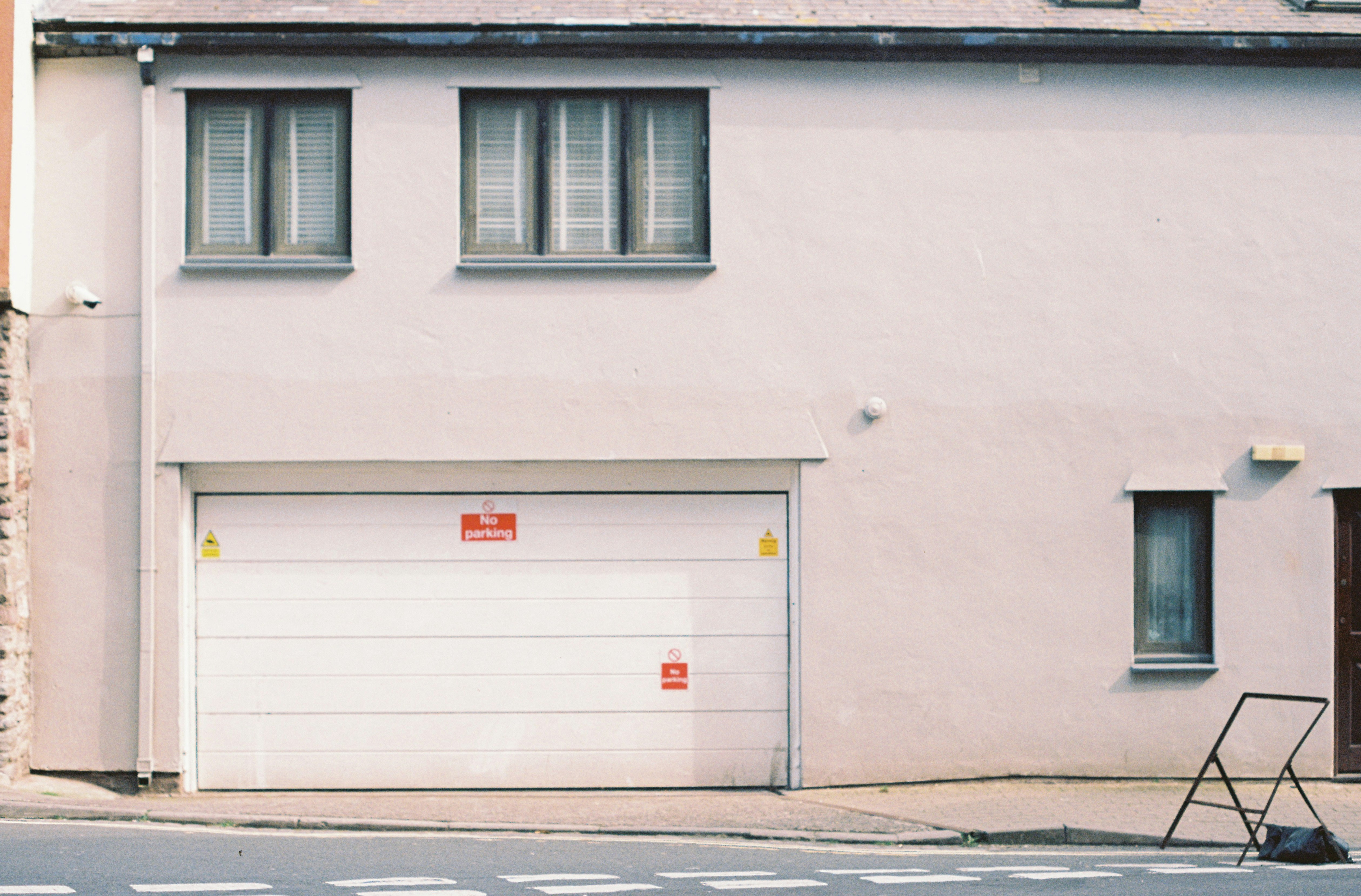 Luxury electric SUV charging on a wallbox charger in a modern home garage