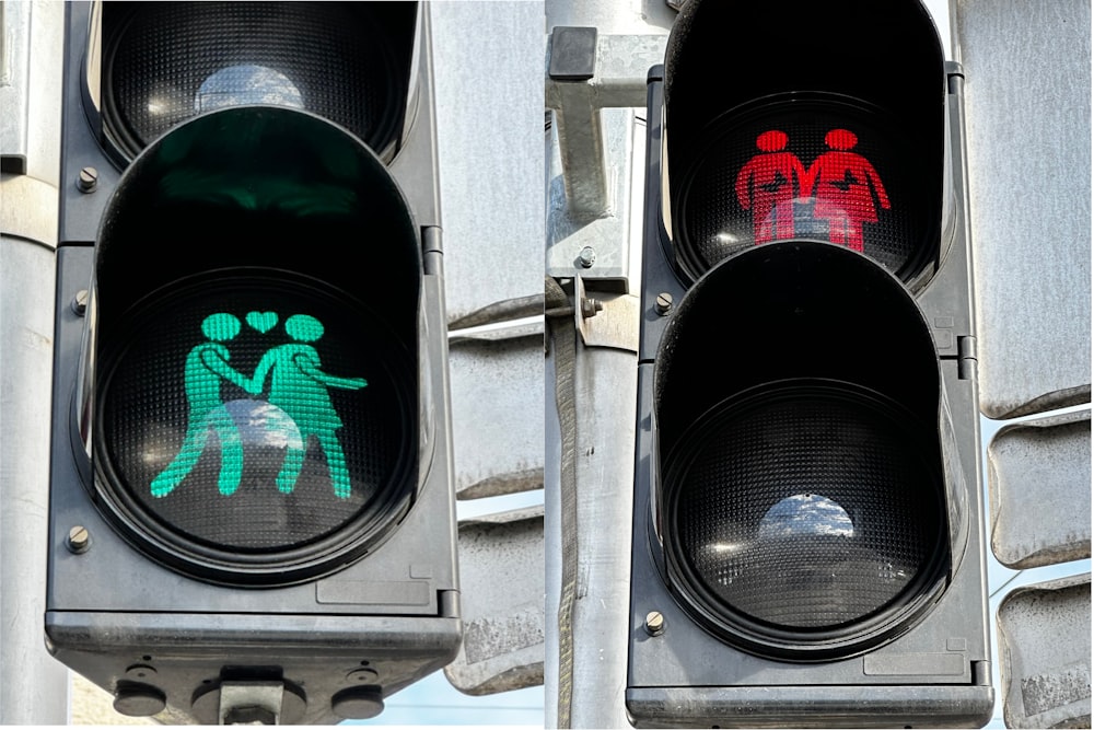 a traffic light with a picture of two people on it