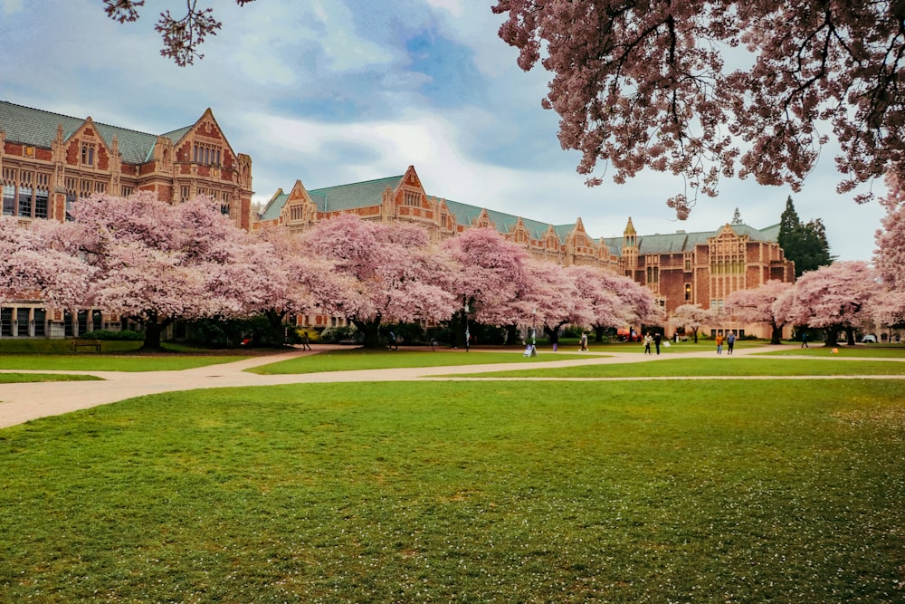 a large building with many trees in front of it